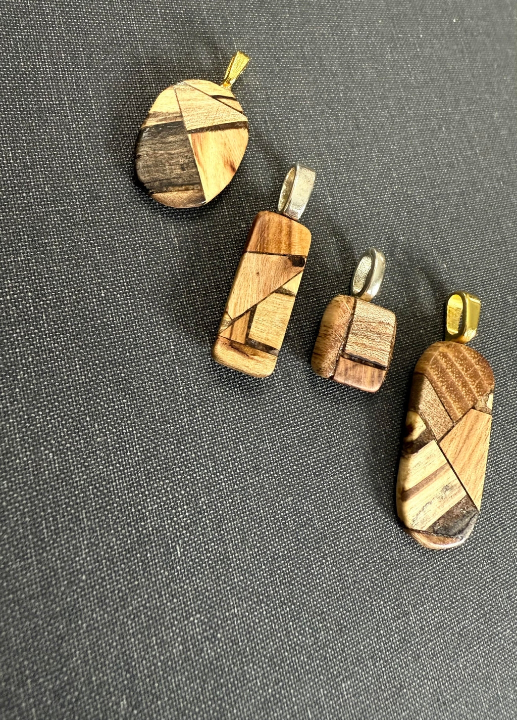 Patchwork Wooden Pendants from Little Valley Wood Shop, Wooden necklaces, nature jewelry, sustainable jewelry, necklaces from reclaimed wood, recycled jewelry, patchwork wood design, small business, handmade jewelry, handmade necklace, wood working, wooden patchwork pendants, unique gifts, ecofriendly gifts, sustainable gifts